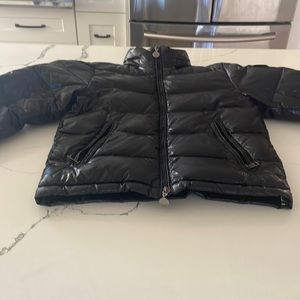 Size 10 Moncler jacket . There is 2 rips on the sleeve.See pictures